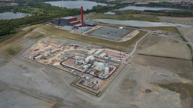Aerial drone view of Millbrook and Rookery industrial power plant, energy generation from gas and oil, smoke stacks, Bedford England UK