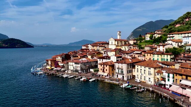 Peschiera Maraglio in Monte Isola, Lake Iseo or Lago d'Iseo. Beautiful island in Lombardy, Italy. Aerial 4K drone video footage