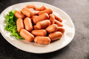 Mini sausages fresh delicious processed meat tasty snack fresh delicious gourmet food background on the table rustic food top view copy space