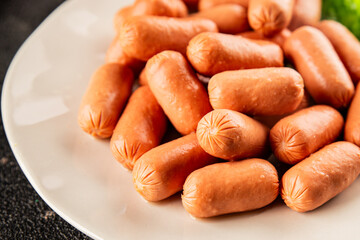 Mini sausages fresh delicious processed meat tasty snack fresh delicious gourmet food background on the table rustic food top view copy space