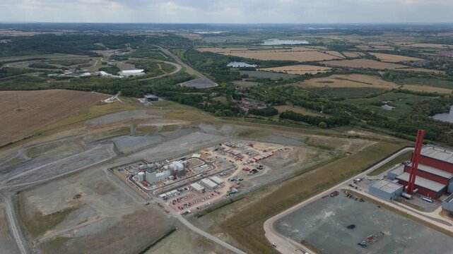 Aerial drone view of Millbrook and Rookery industrial power plant, energy generation from gas and oil, smoke stacks, Bedford England UK