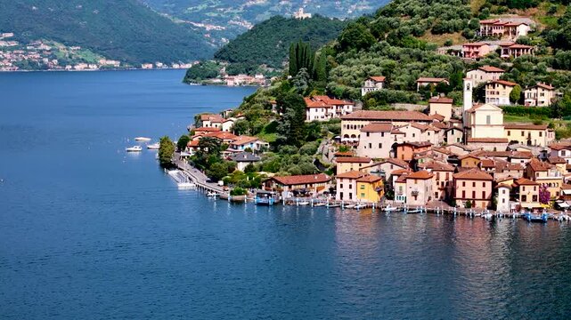Peschiera Maraglio in Monte Isola, Lake Iseo or Lago d'Iseo. Beautiful island in Lombardy, Italy. Aerial 4K drone video footage