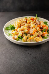 Potato salad with smoked fish tasty snack fresh delicious gourmet food background on the table rustic food top view copy space