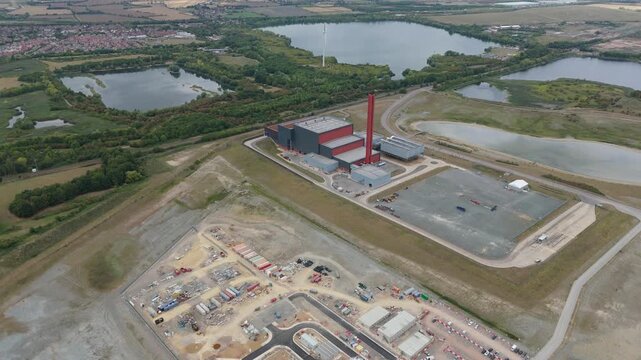 Aerial drone view of Millbrook and Rookery industrial power plant, energy generation from gas and oil, smoke stacks, Bedford England UK
