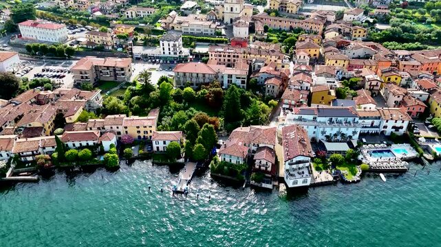 Sulzano town in Monte Isola, Lake Iseo or Lago d'Iseo. Beautiful island in Lombardy, Italy. Aerial 4K drone video footage