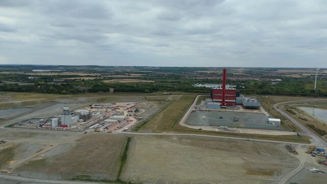 Aerial drone view of Millbrook and Rookery industrial power plant, energy generation from gas and oil, smoke stacks, Bedford England UK