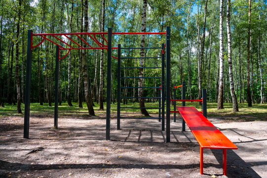 Gymnastic horizontal bars and parallel bars outside without people.
