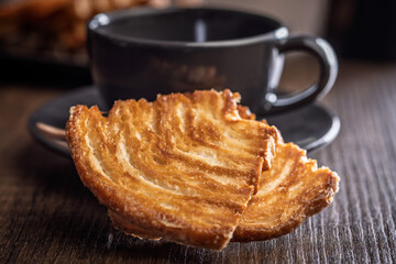 Le sfoglie. Crispy sweet pastry on wooden table.