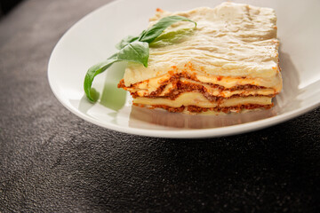 Lasagna bolognese béchamel sauce, meat, cheese second course tasty snack fresh delicious gourmet food background on the table rustic food top view copy space