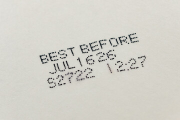 Close up text best before date on bottom of packaged food