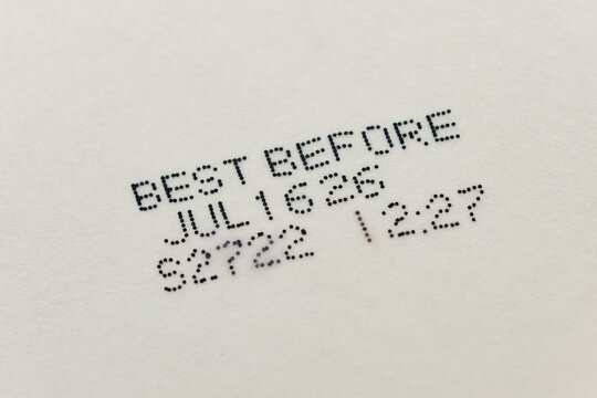 Close up text best before date on bottom of packaged food