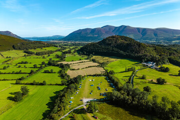 Lush green fields, fells, and farmland of the English Lake District in summer © whitcomberd