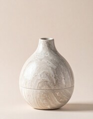 Elegant Stone Textured Ceramic Vase On a Beige Background in a Studio Shot