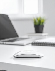 Minimalist White Office Desk with Laptop Computer and Wireless Mouse in Natural Lighting