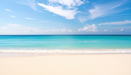 Serene tropical beach scene with turquoise water and white sand under a bright blue sky