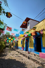 Traditional Christmas decoration with papel picado banners in a Mexican town
