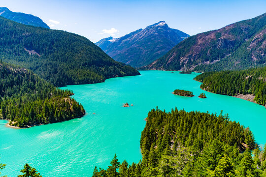 Landscape of mountain peak and Diablo lake. Nature landscape. Diablo Lake in North Cascades National Park. Scenic nature view over lake. Diablo lake with mountain landscape. Diablo wilderness