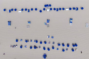 Aerial top view of sand beach with turquoise water. Luxury resort. Paradise beach. Summer vacation....