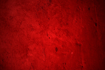 Heavily textured dark red surface, possibly plaster or concrete. Ideal for backgrounds, textures, or design elements in graphic projects.