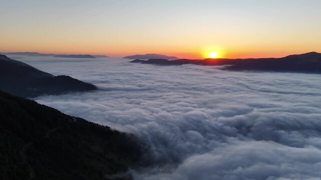 Scenic Drone Shot of Fog Covering Mountains During Golden Hour in Trabzon