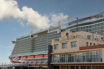 Cadiz, Spain, September 12 2024 Large Cruise Ship Docked Near Maritime Office on a Sunny Day