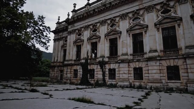 The basketball court of presently abandoned political educational institution in Kumrovec, Croatia, formerly grand edifice deteriorating over time, once celebrated now neglected, the remains of signi