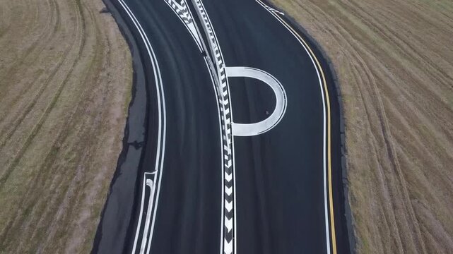 conceptual road design shaped like the letters A, B, C, and D with standard white and yellow pavement markings