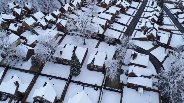 Drone-captured ry of suburban locality during the winter season following precipitation event of frozen crystalline water