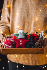 Family time, leisure activity, hobby, holiday recreation with children. Process of creation of handmade Christmas toys with cloth, buttons, honeycomb craft recycled paper. Zero waste, diy gift