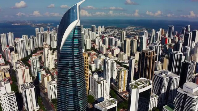 Elevated Overhead Perspective of Prominent Skyscraper Tower Embedded Within Dense Urban Cityscape