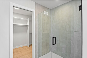 Bathroom with a shower and a walk in closet