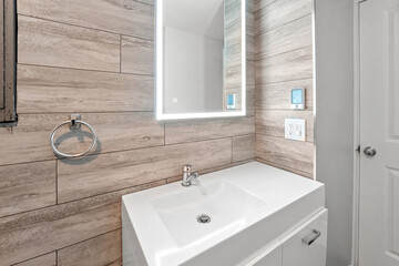 Bathroom with a white sink and a mirror above it