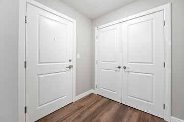 White door with a black hole in it is in a hallway