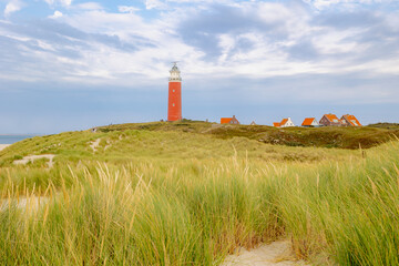 The Eierland Lighthouse on the northernmost top of the Dutch island of Texel, Red lighthouse tower...