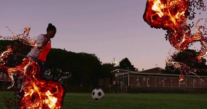 digital embers swirling at field edges, female soccer player planting foot kicking ball in training - Powered by Adobe