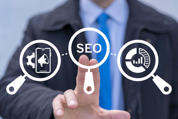 Business person using virtual touch screen presses the acronym SEO. Creative Web SEO Search Engine...