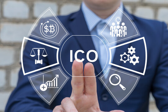 ICO Initial Coin Offering Financial Concept. Business person using virtual touch screen presses the acronym ICO. Investment, cryptocurrency, blockchain, coin and digital asset.