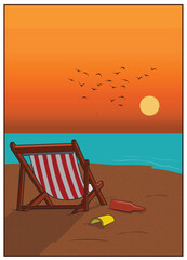 A view of a beach sunset with a chair.