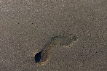 Man’s Footprint on Sandy Cyprus Beach