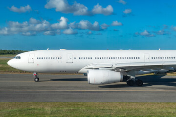 A side view of a large passenger plane on the tarmac at Punta Cana airport, ready for departure.