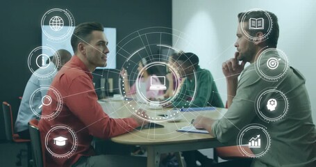 Analyst and manager seating in office initiating business meeting, showing animated ring with icons - Powered by Adobe