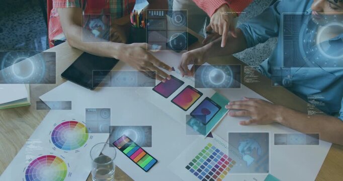 Designers grabbing screen card and starting holographic UI prototypes while testing color schemes