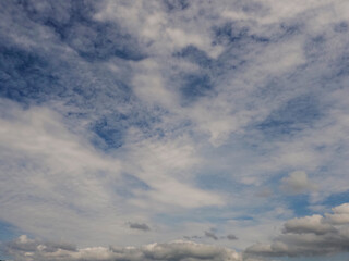 Blue cloudy sky. Nature background for design. Cloudscape.