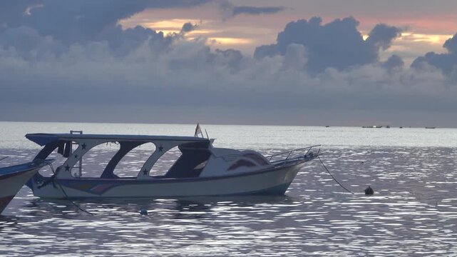 Pleasure boats at Bunaken Island Roadstead, Sulawesi, Sulawesi Sea at sunset