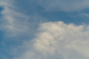 Cumulus and Cirrus Clouds in Blue Sky