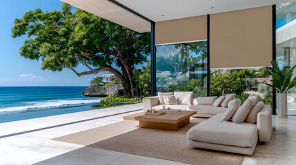 Elegant living room with stunning ocean views. Roller blinds, modern furniture, and tropical landscaping create a haven of peace and tranquility.