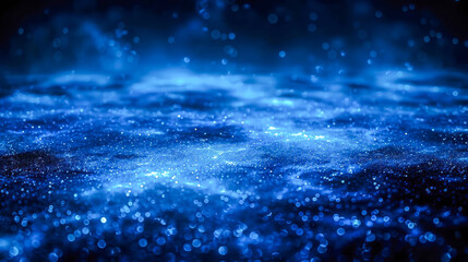 Fototapeta premium Abstract blue background with shimmering particles creating a cosmic atmosphere and depth