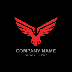 Fototapeta premium A modern, stylized red eagle or hawk logo with spread wings on a black background, with placeholder text for a company name and slogan.