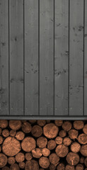 Wooden log stacked under a wooden house with copy space