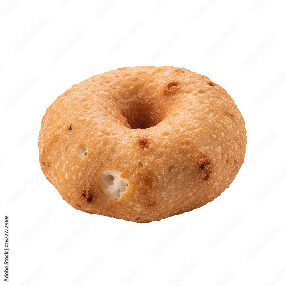 Poster vada sits against a plain background showing its circular shape with a hole and fried texture.